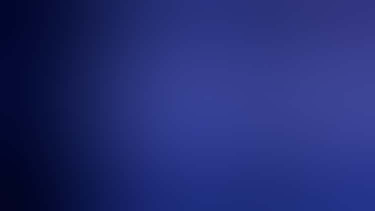 Against a black background, white pigment streams down from the top and splashes and puddles at the bottom. The pigment glows blue and white in a combination of white and UV lighting.